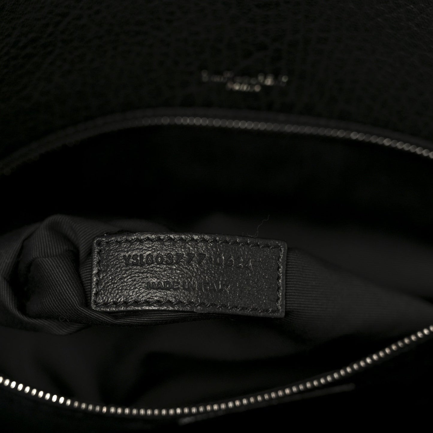 Black leather satchel interior brand label on lining
