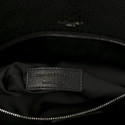 Black leather satchel interior brand label on lining