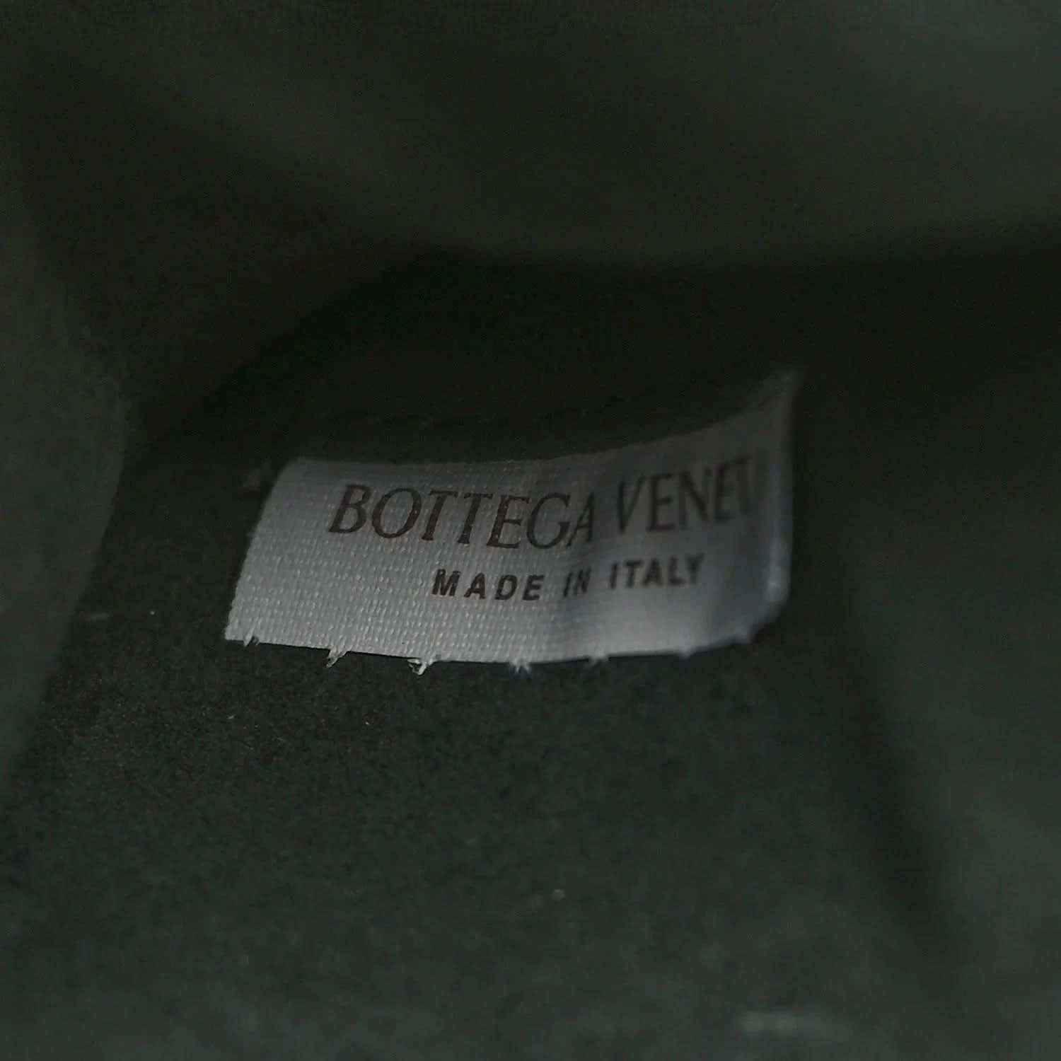 Bottega Veneta label on dark green leather, Made in Italy