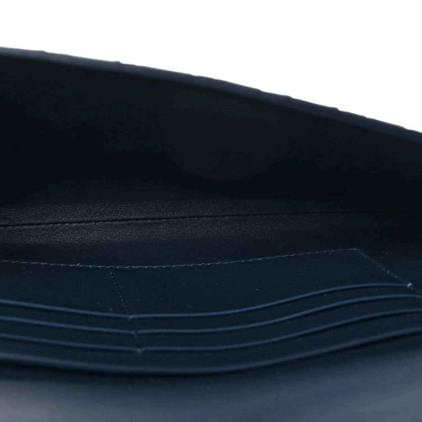 Blue suede clutch interior with stitched trim