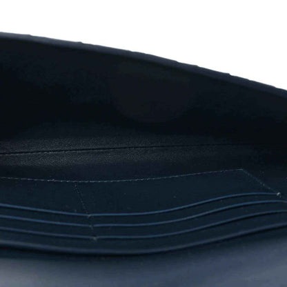 Blue suede clutch interior with stitched trim