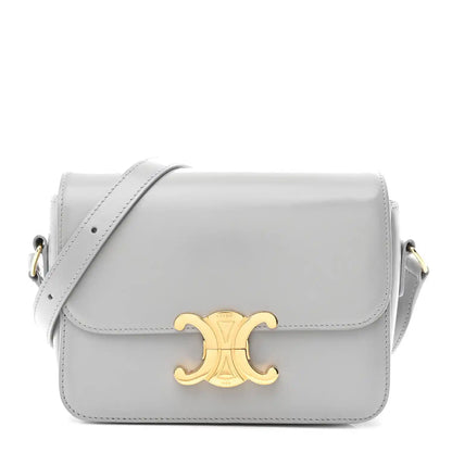 Shiny calfskin shoulder bag with flap and gold-tone front logo clasp
