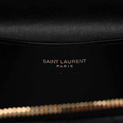 Saint Laurent Paris branding on black leather lining inside mini vanity case