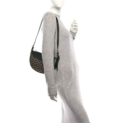Black monogram canvas crossbody handbag with black leather shoulder strap