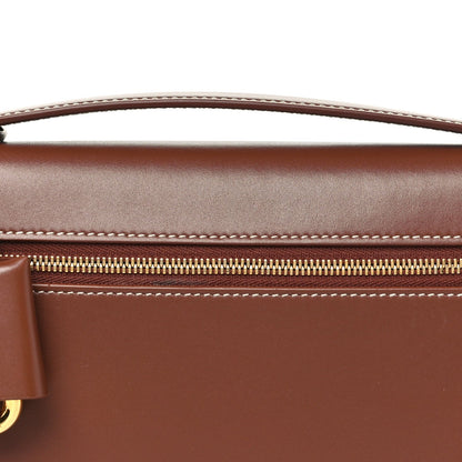 Loro Piana smooth calfskin clutch detail with gold zipper and contrast stitching
