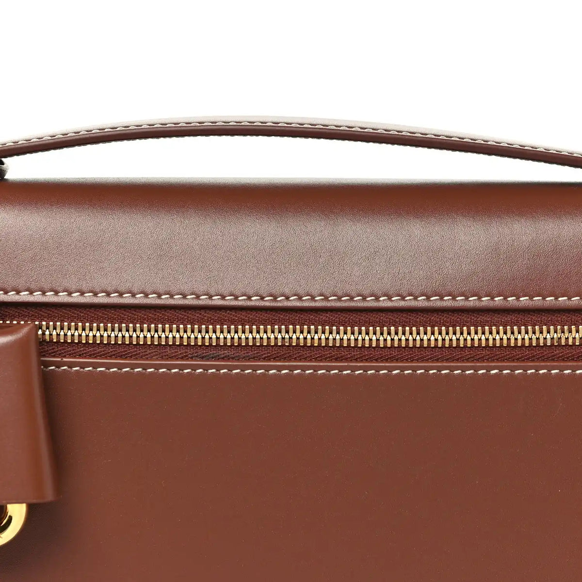 Loro Piana smooth calfskin clutch detail with gold zipper and contrast stitching