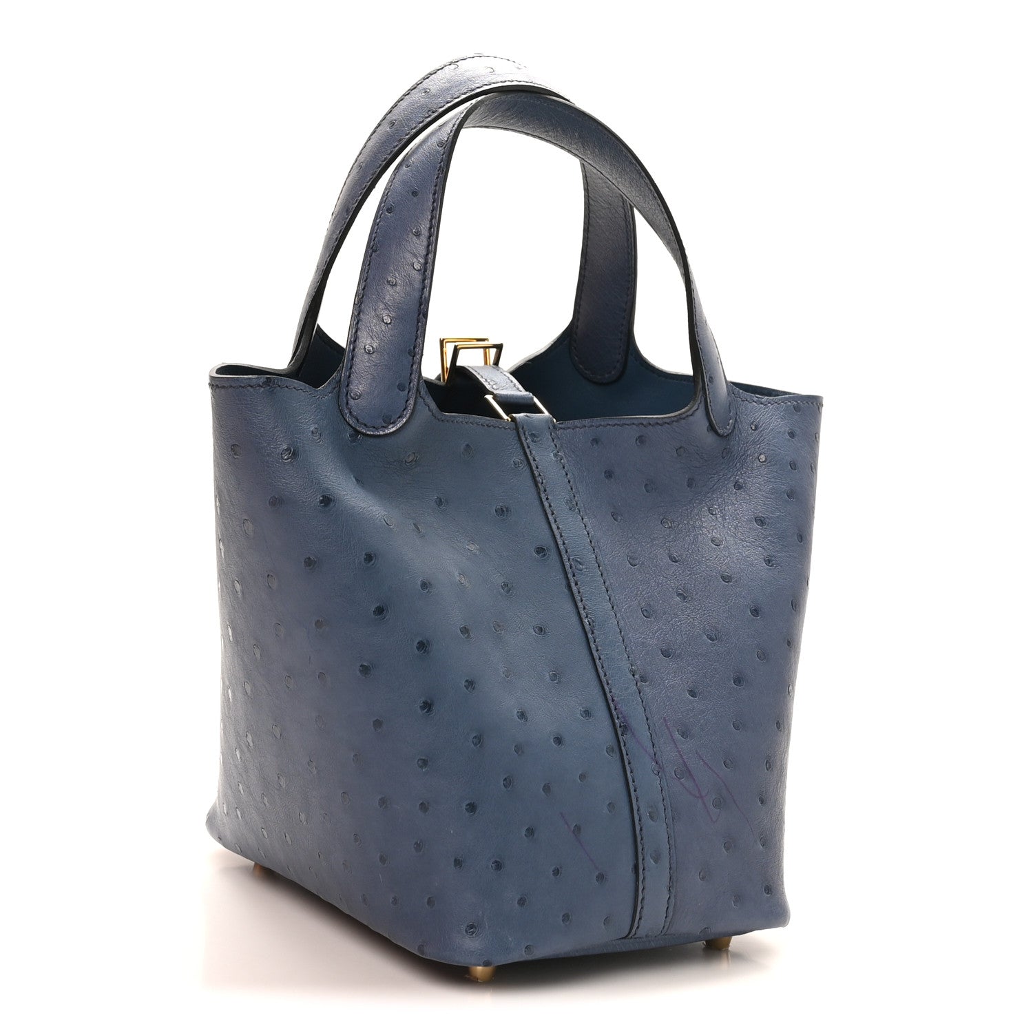 Blue ostrich leather bucket bag with top handles, structured sides, and gold lock hardware.