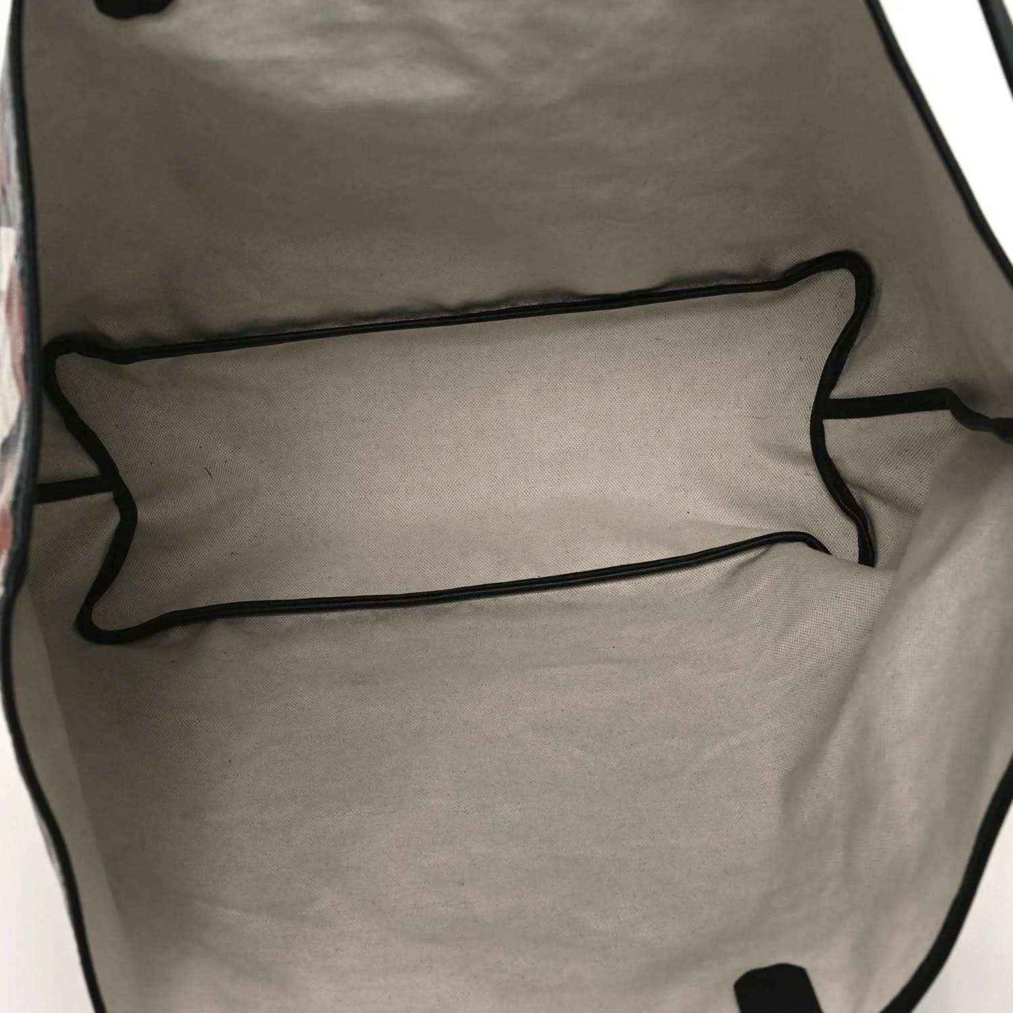 PM tote bag interior lining in light fabric with black piping along the top edge