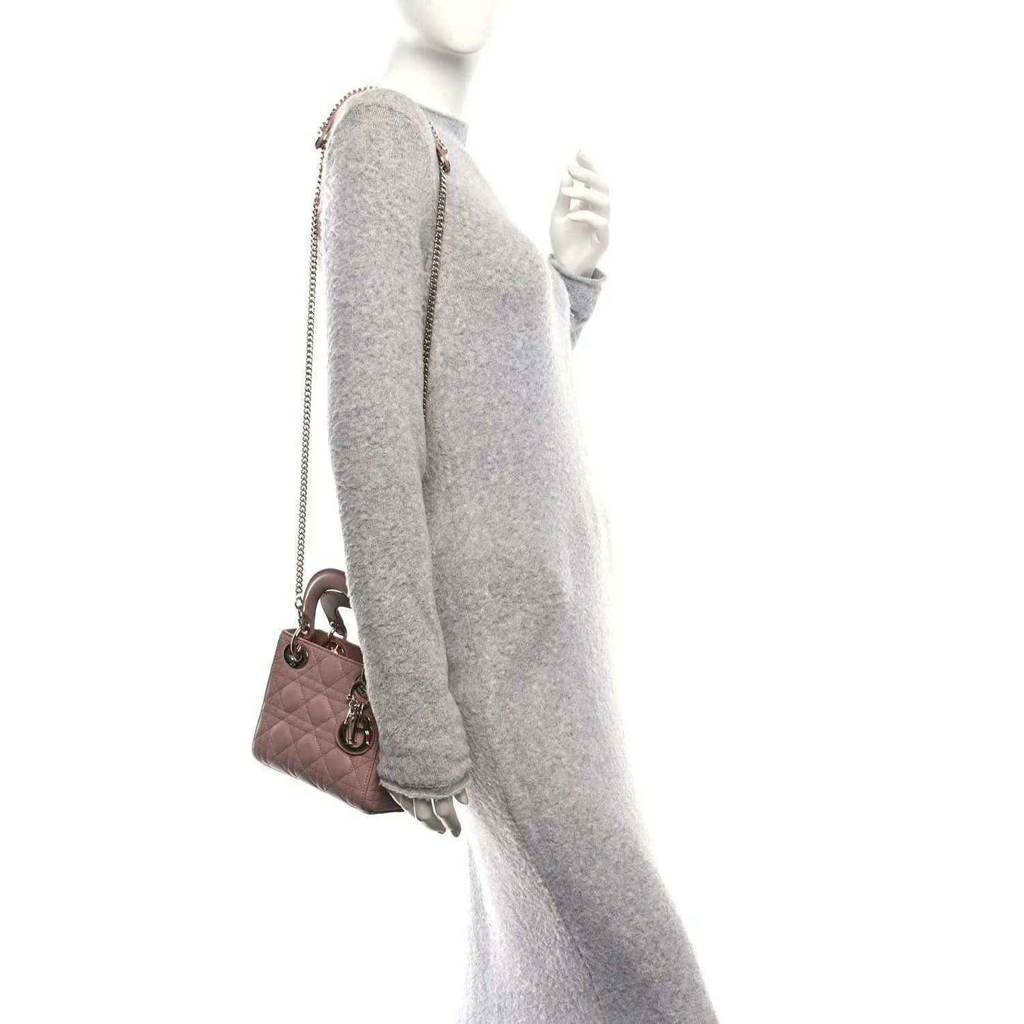 Mini Lady Dior handbag side view with chain strap and pink body, gold-tone hardware.