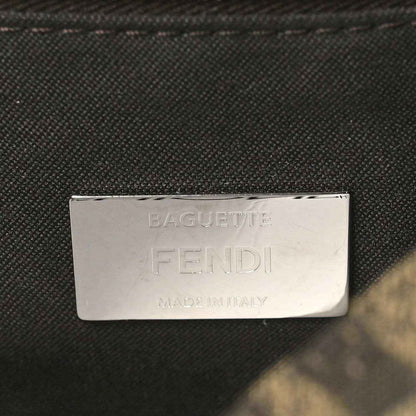 Fendi Baguette label patch on dark fabric lining, text reads FENDI MADE IN ITALY.