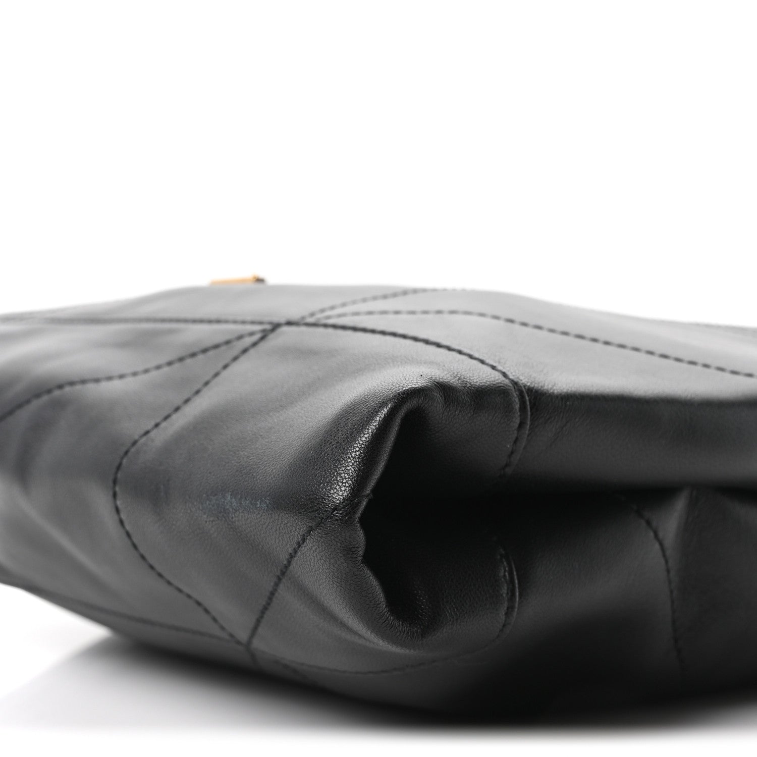 Black quilted lambskin shoulder bag with stitched panels and curved opening