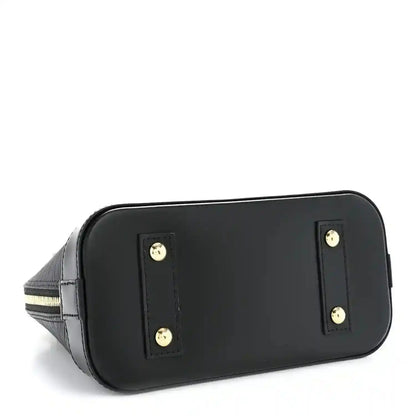Black handbag back panel with two gold-tone logo studs and smooth leather trim