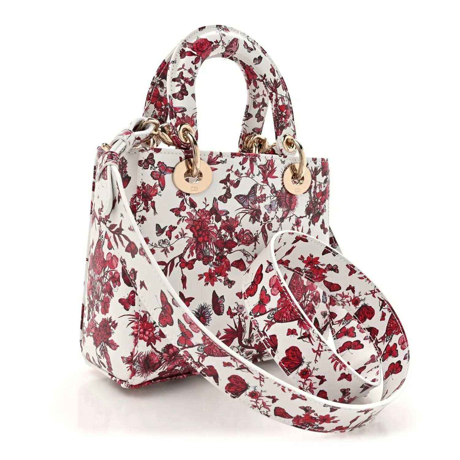 White and red floral handbag with top handles and gold-tone Dior charm detail