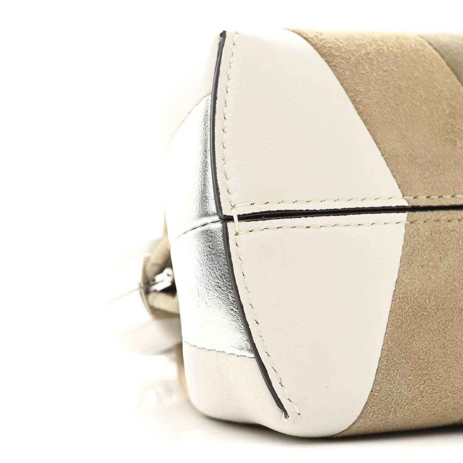 Striped nappa suede clutch side view with stitched edge seam and hardware