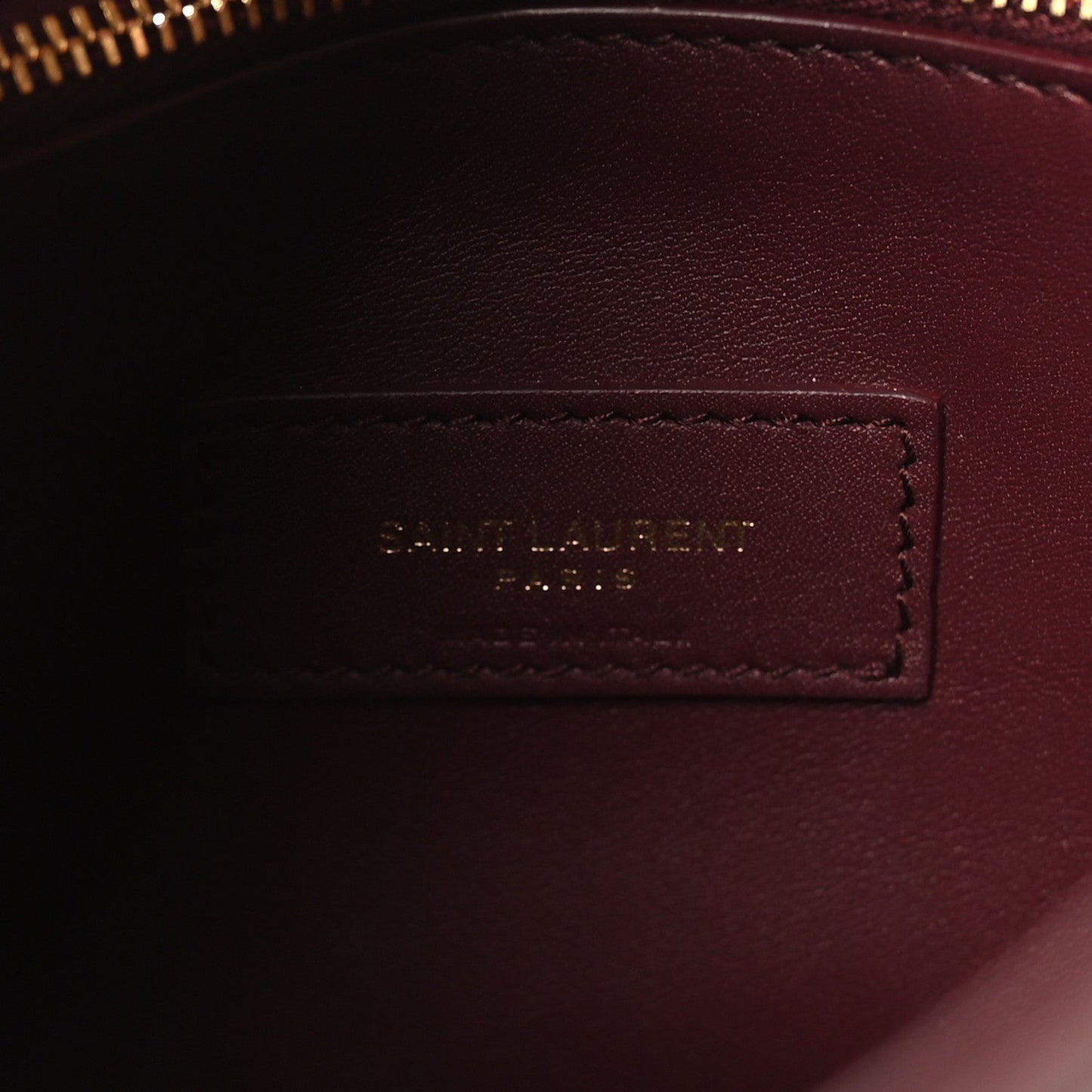 Burgundy leather interior label patch with stitched border