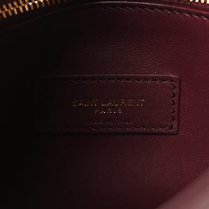 Burgundy leather interior label patch with stitched border