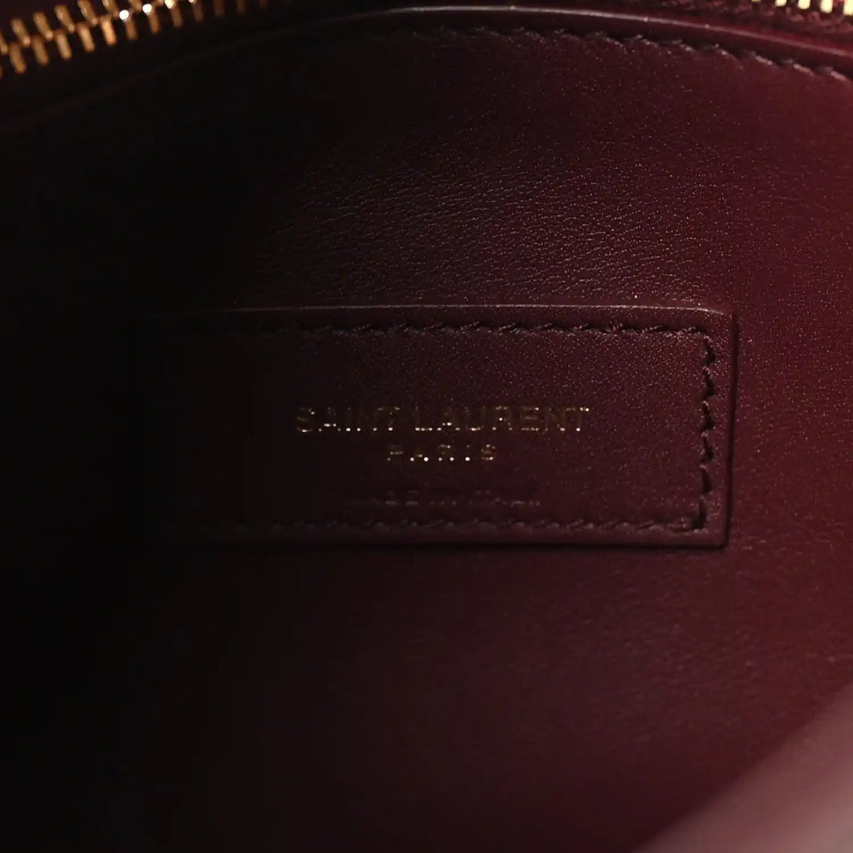 Burgundy leather interior label patch with stitched border