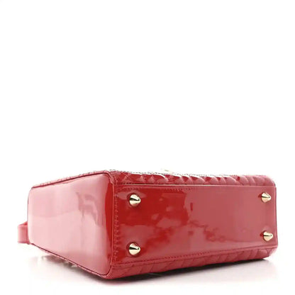 Christian Dior small red patent quilted handbag, bottom corner with gold feet and studs