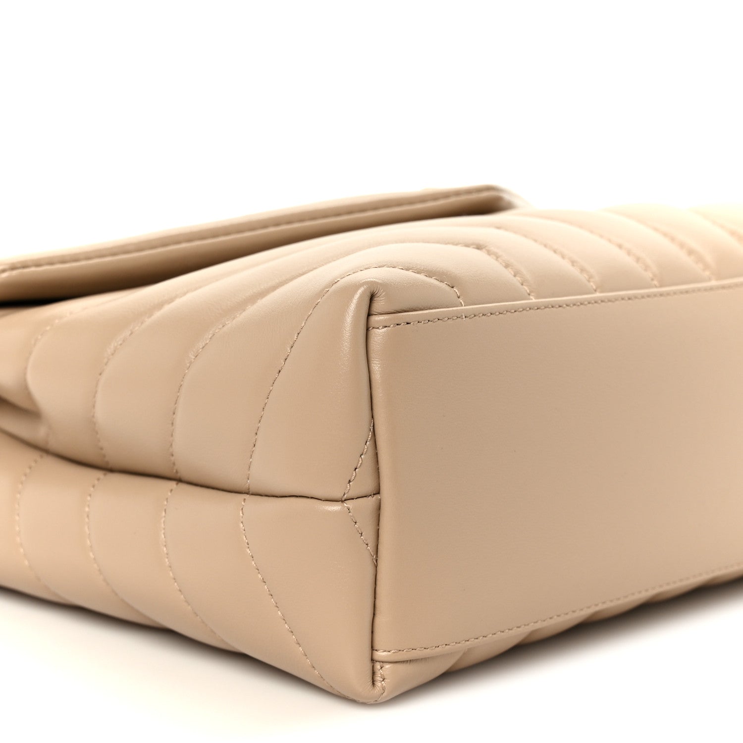 Dark beige quilted leather satchel side profile with structured edges and top handle