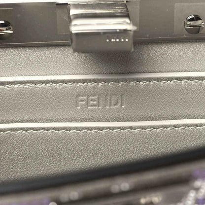Small satchel interior close-up with embossed FENDI logo on lining