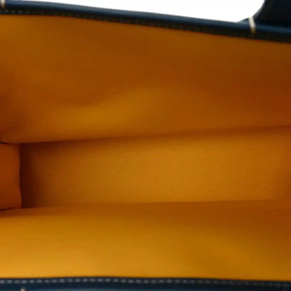 Villette PM tote interior with orange lining and visible top edge seam.