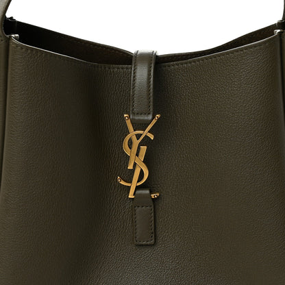 Calfskin hobo bag front flap with gold YSL lock charm and leather tab.