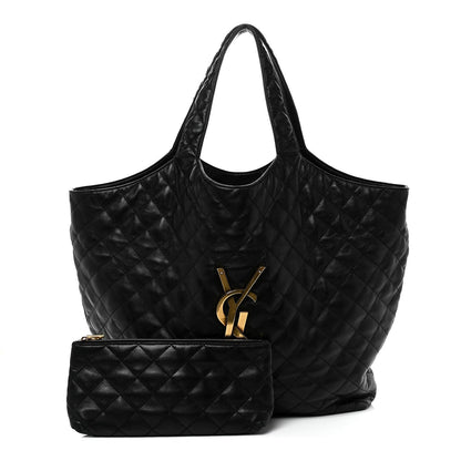 Black quilted leather tote with YSL logo and matching small pouch