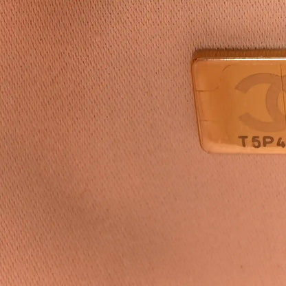 Copper leather lining with small rectangular serial label visible on interior.