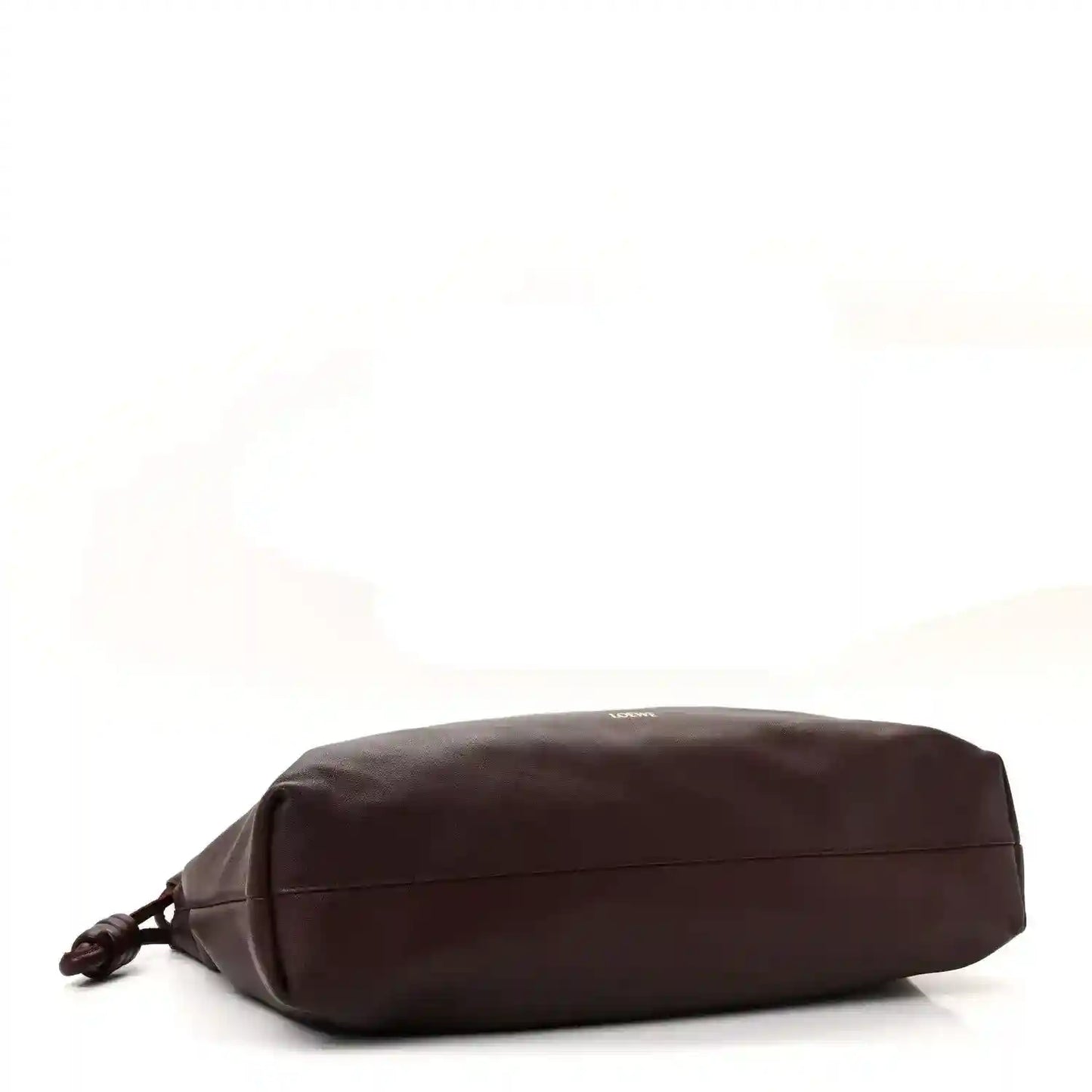 Dark burgundy leather clutch back view with stitched panel lines