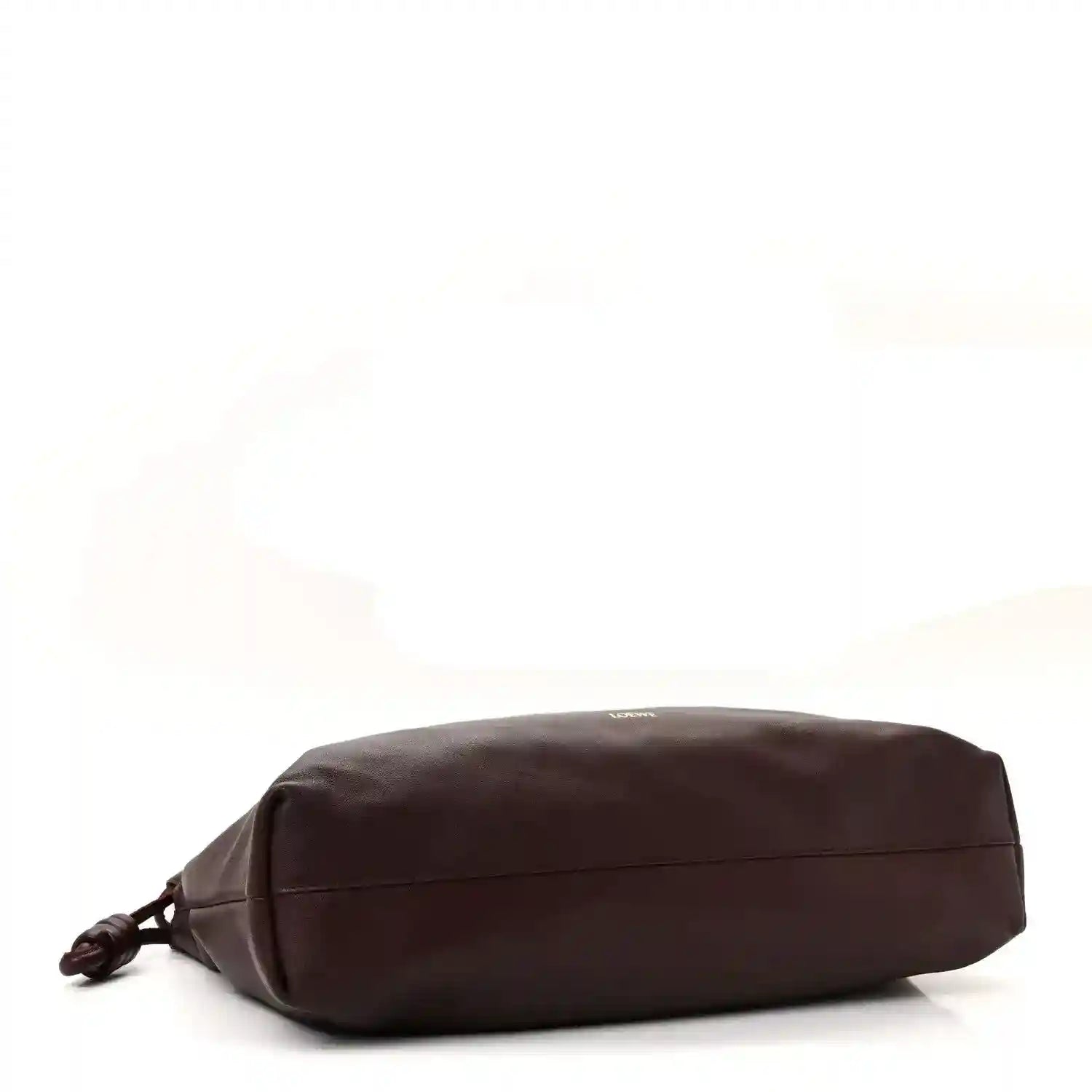 Dark burgundy leather clutch back view with stitched panel lines