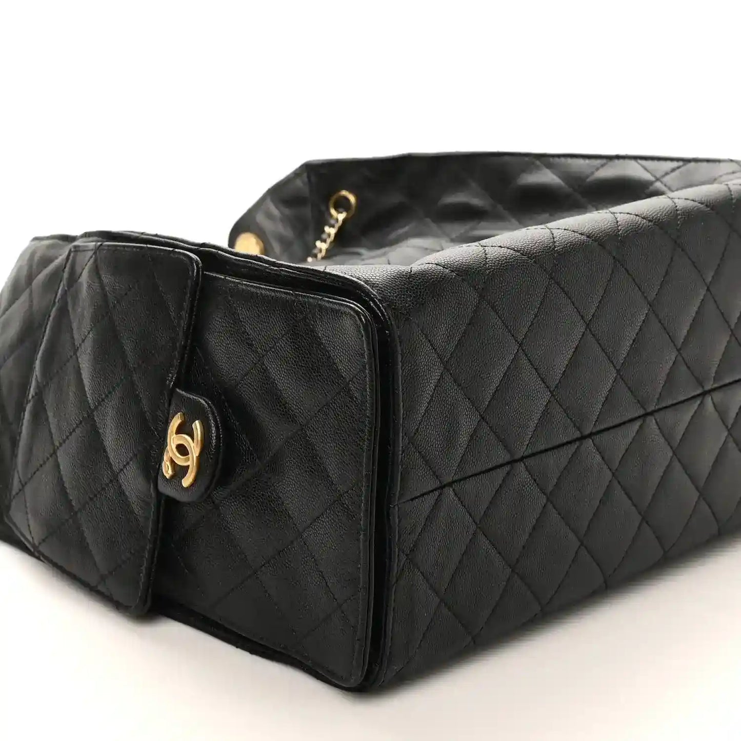 Black Chanel quilted leather handbag with gold hardware and chain strap, medium size