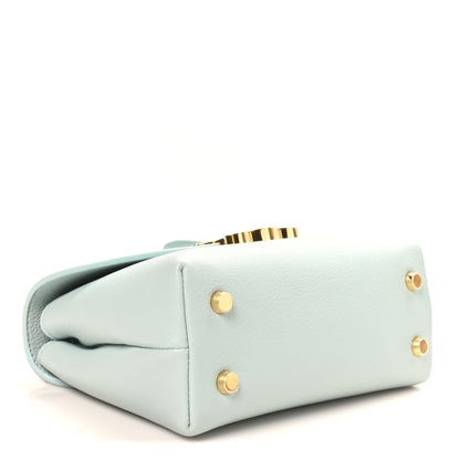 Light blue leather handbag base with gold snap studs at the back corners