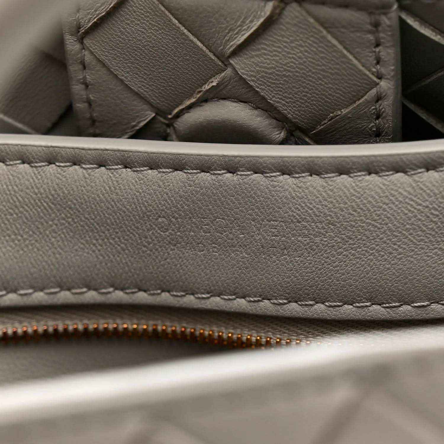 Andiamo shoulder bag close-up of sterling grey woven nappa edge with stitching