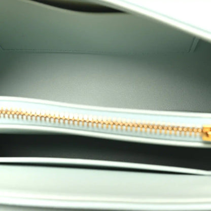 Leather lining with gold zipper track and pull tab