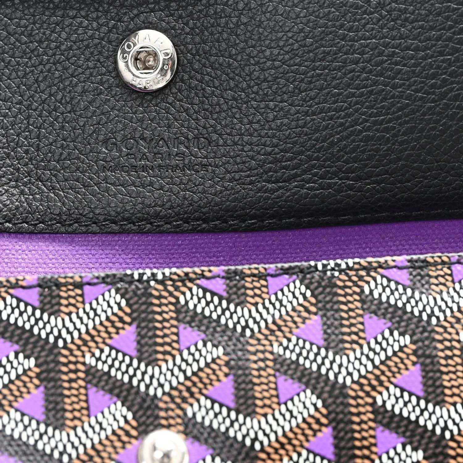 Tote bag logo patch and monogram pattern trim, black leather top with purple lining
