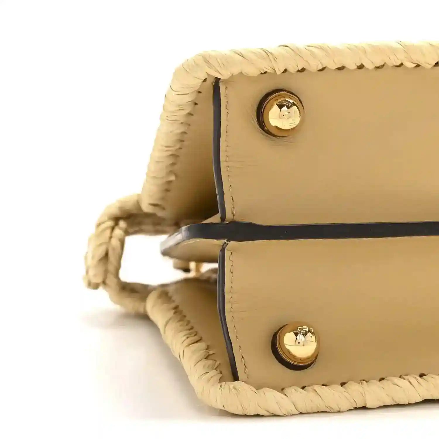 Petite raffia satchel bag side view with tan leather flap and gold snap buttons.