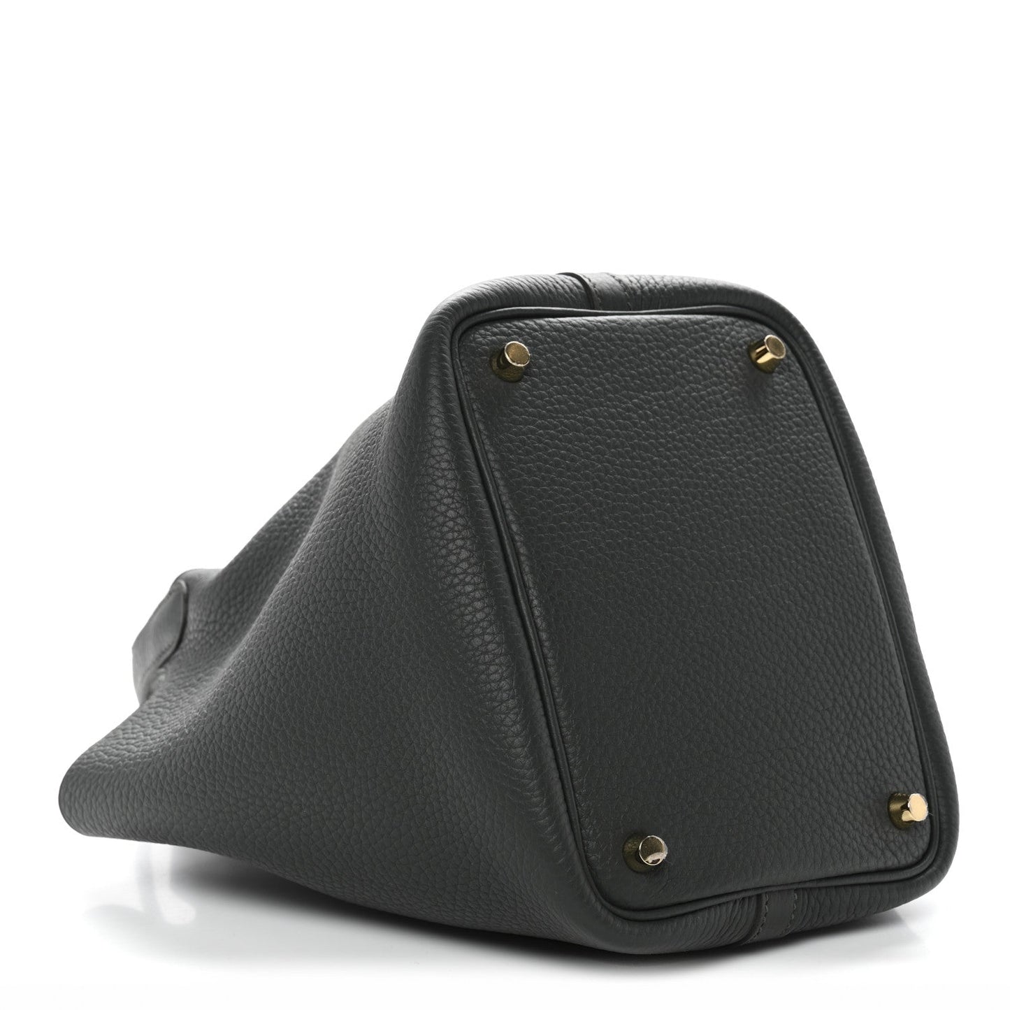 Textured dark green mini bag with structured triangular shape and gold corner studs.