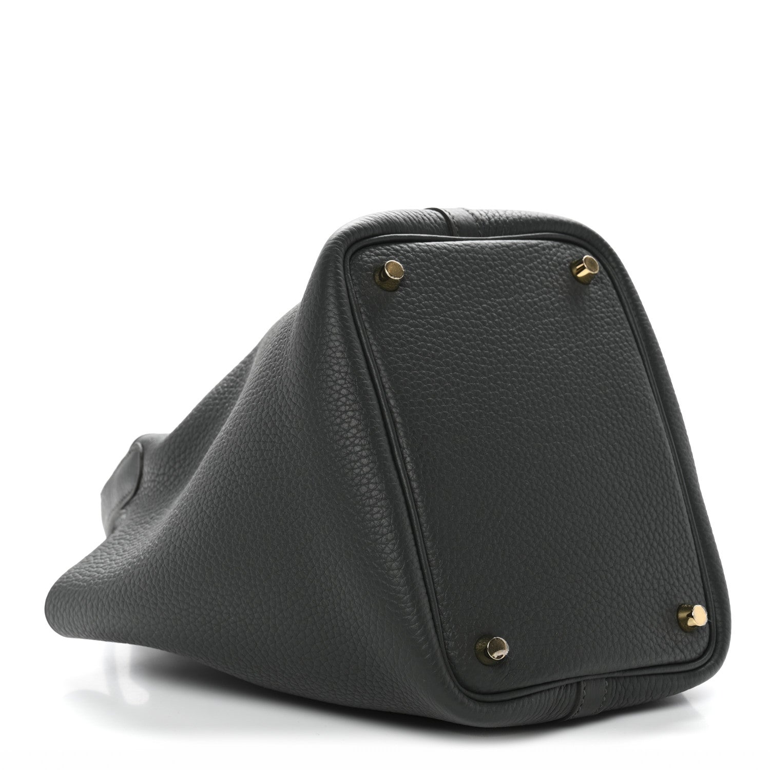 Textured dark green mini bag with structured triangular shape and gold corner studs.