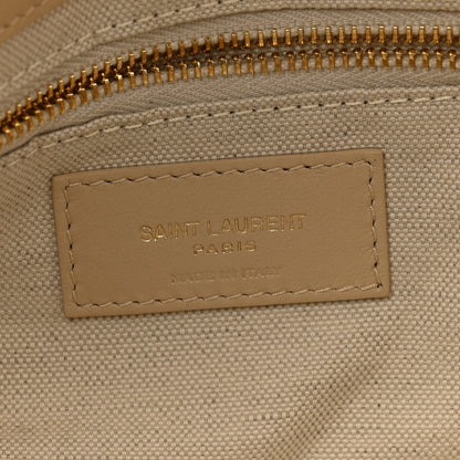 Beige interior leather label reading SAINT LAURENT PARIS with stitched border