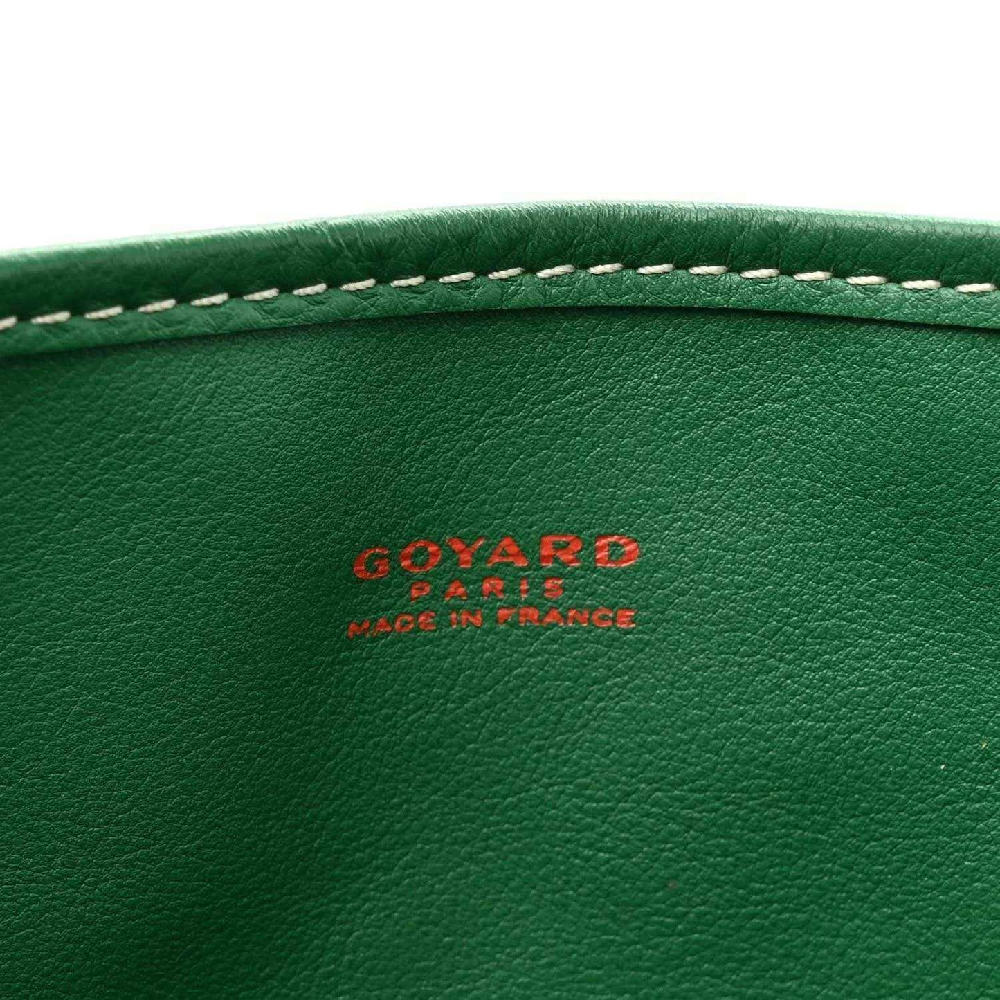 Green leather panel with GOYARD logo and 'made in france' text