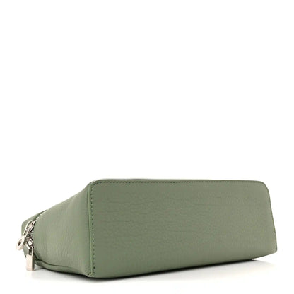 Sage green grained calfskin pouch with top zip and curved sides