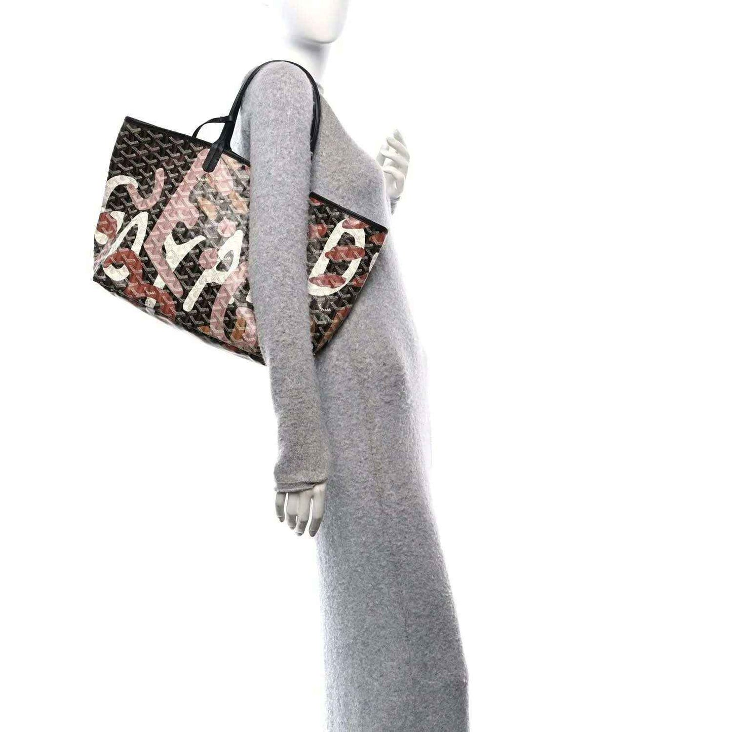PM tote bag with black handles and dark monogram fabric, multicolor letter print along the side