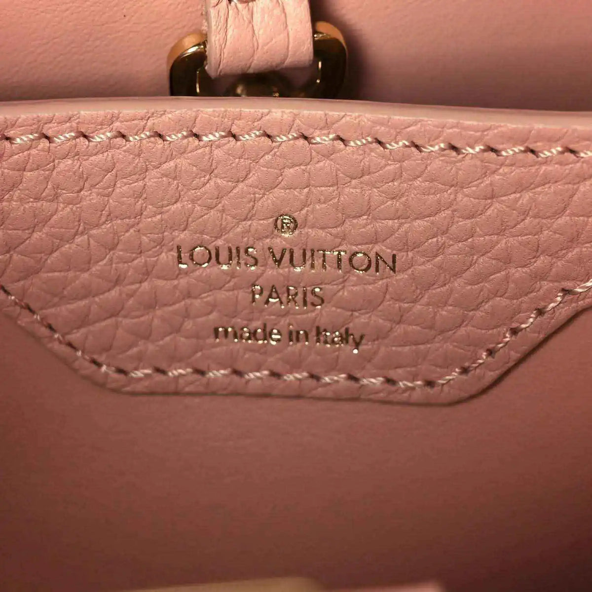 Leather interior stamp reading Louis Vuitton Paris made in Italy