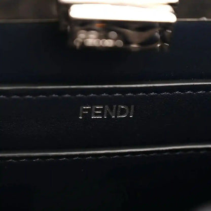 FENDI logo on dark nappa leather satchel, silver-tone rectangular plaque