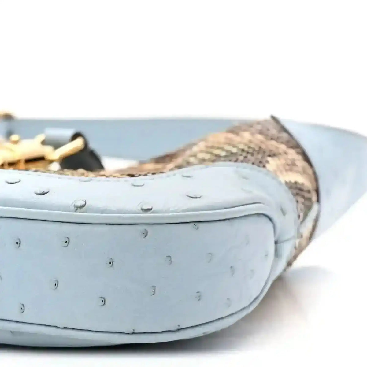 Hobo bag bottom edge close-up with light blue leather and snakeskin trim