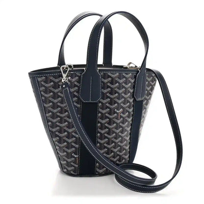 Navy patterned tote bag with top handles and adjustable crossbody strap