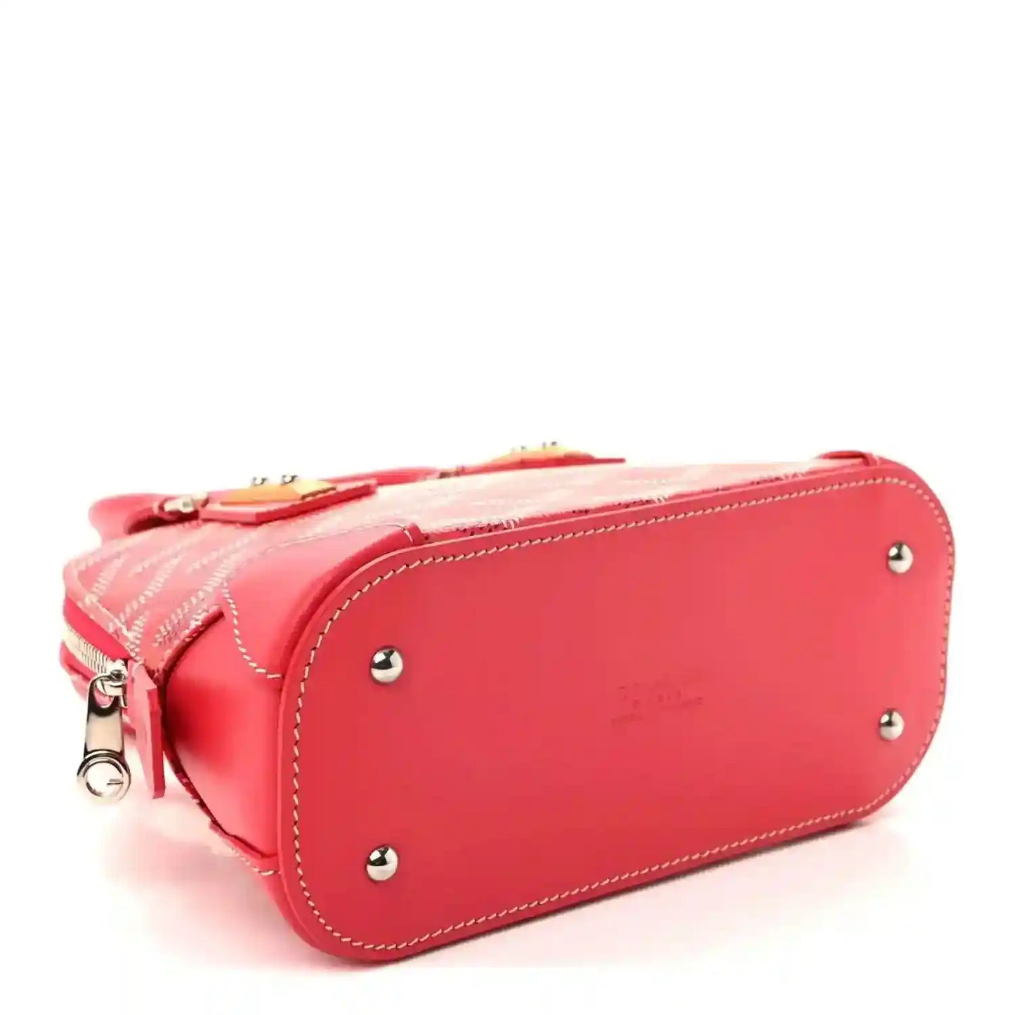 Red mini handbag with curved top zipper, silver studs, and contrasting stitch trim