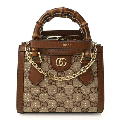 Mini tote bag with GG monogram canvas, brown leather trim, bamboo handles, gold-tone chain strap
