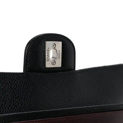 Chanel Paris label on black leather interior panel with caviar texture