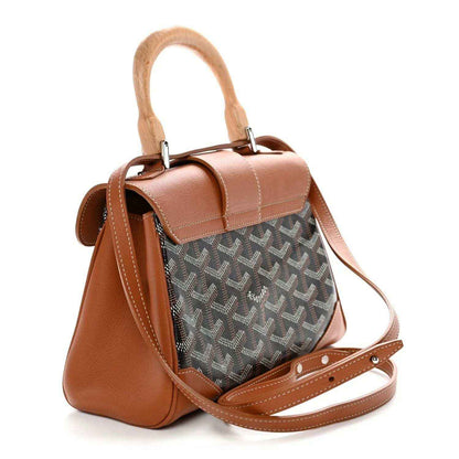 Mini shoulder bag with top handles and crossbody strap, tan leather and dark patterned canvas